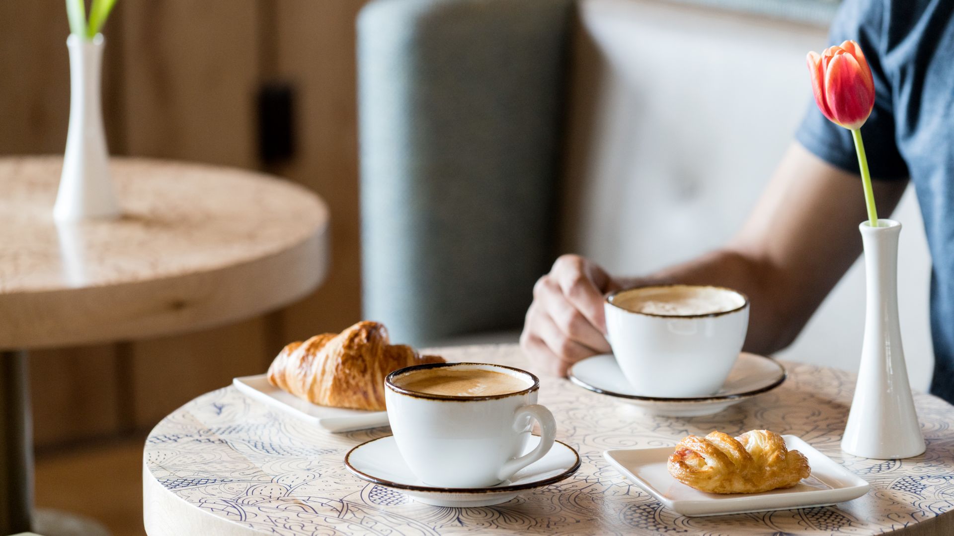A Table With Coffee And Pastries