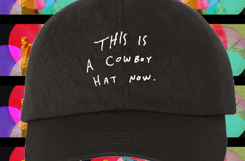 Black baseball had that reads 'This is a cowboy hat now'