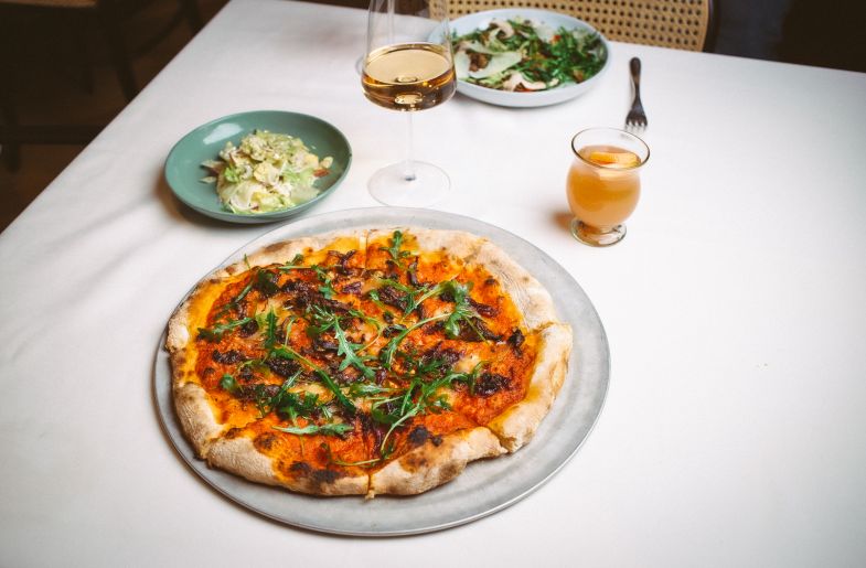 A Pizza With A Glass Of Wine